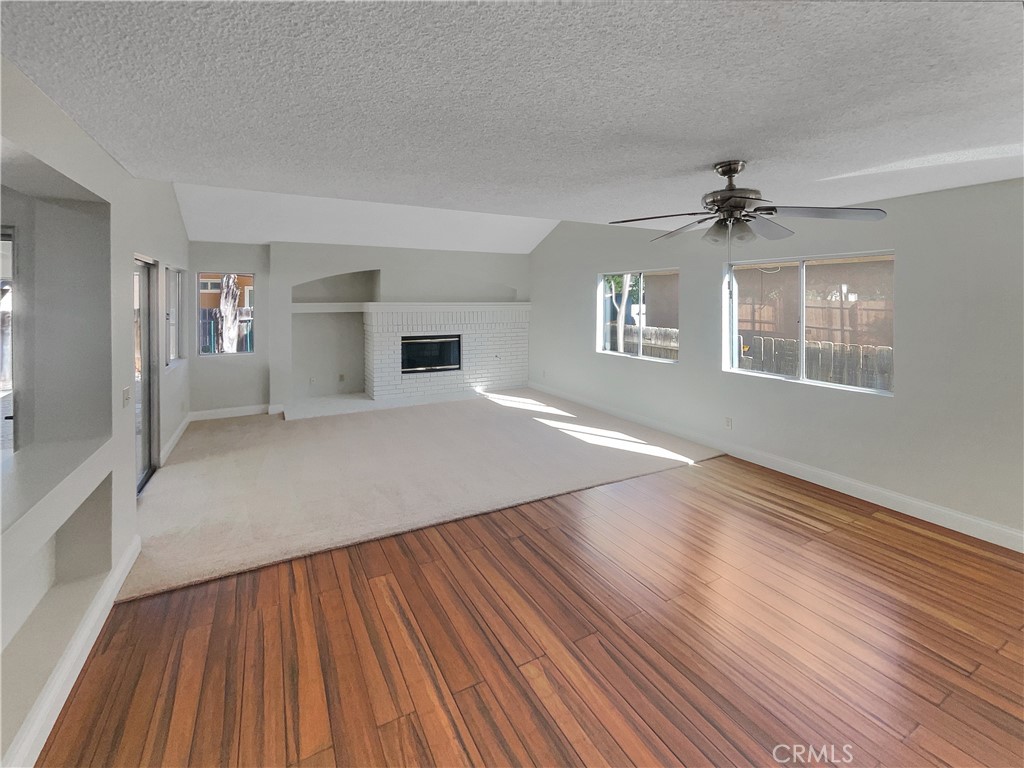 662 Spinnaker Drive Perris, CA 92571 - Photo 8 of 23 wooden floor in an empty room with a window