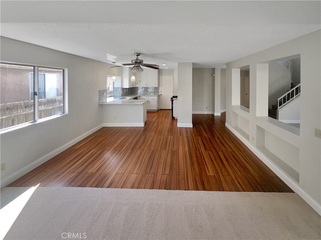 662 Spinnaker Drive Perris, CA 92571 - Photo 9 of 23 a living room with kitchen view and a window
