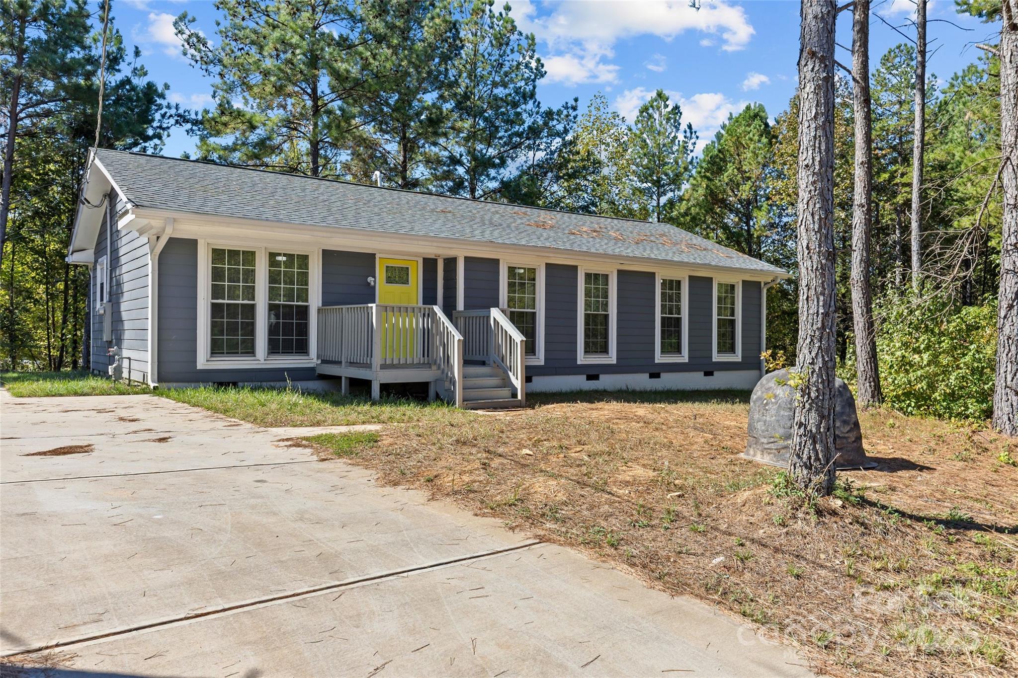 front view of a house with a yard