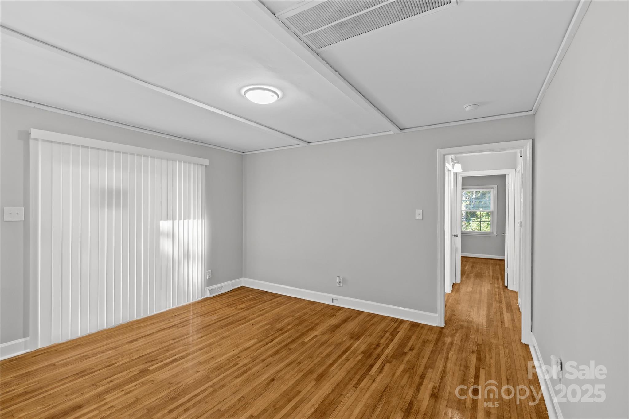 8341 Reedy Creek Road Charlotte, NC 28215 - Photo 14 of 40 a view of empty room with wooden floor