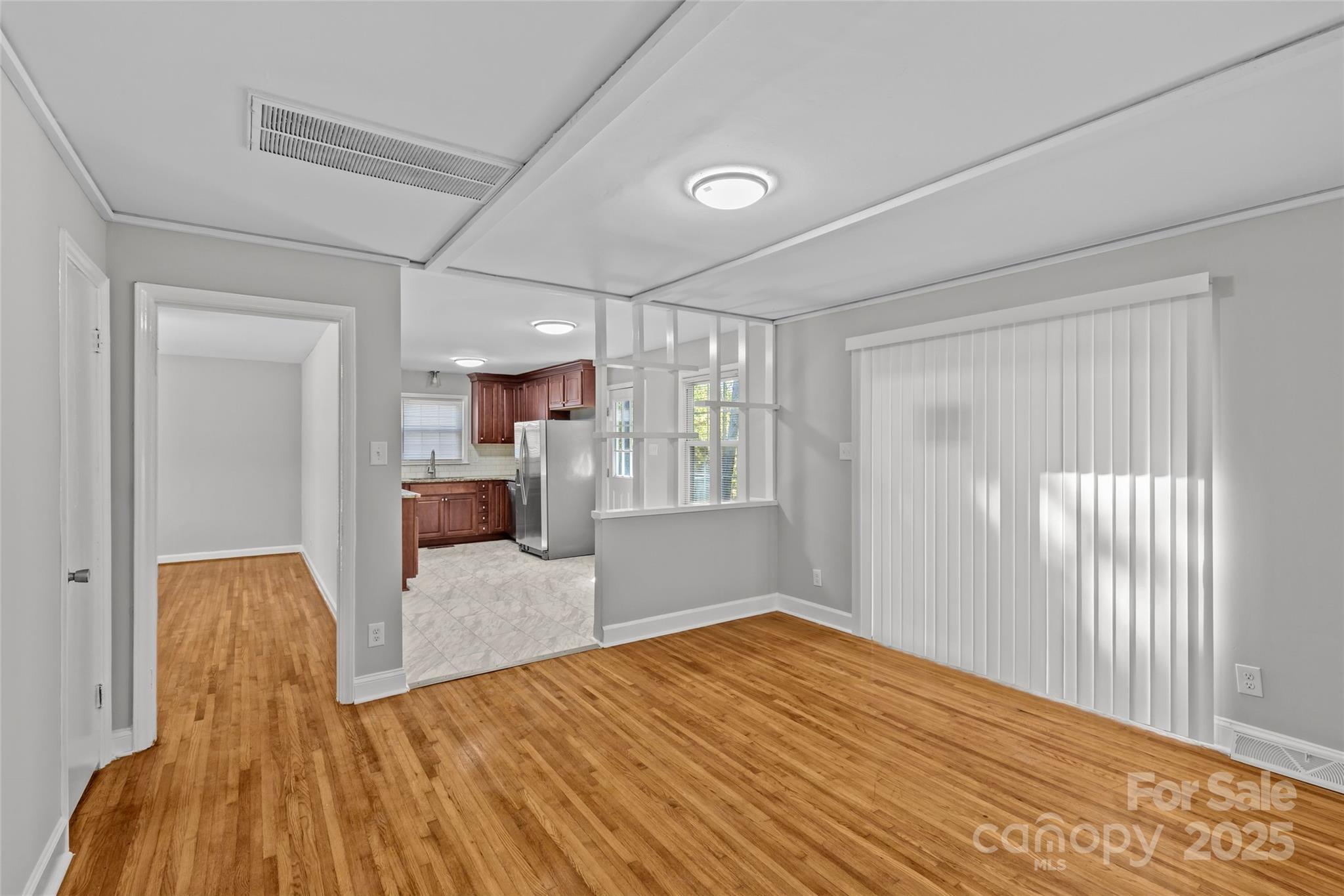 8341 Reedy Creek Road Charlotte, NC 28215 - Photo 15 of 40 a bedroom with a bed and wooden floor