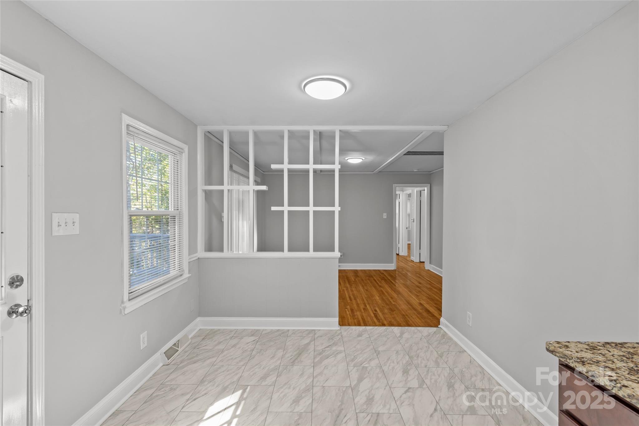 8341 Reedy Creek Road Charlotte, NC 28215 - Photo 24 of 40 a view of an empty room with a window