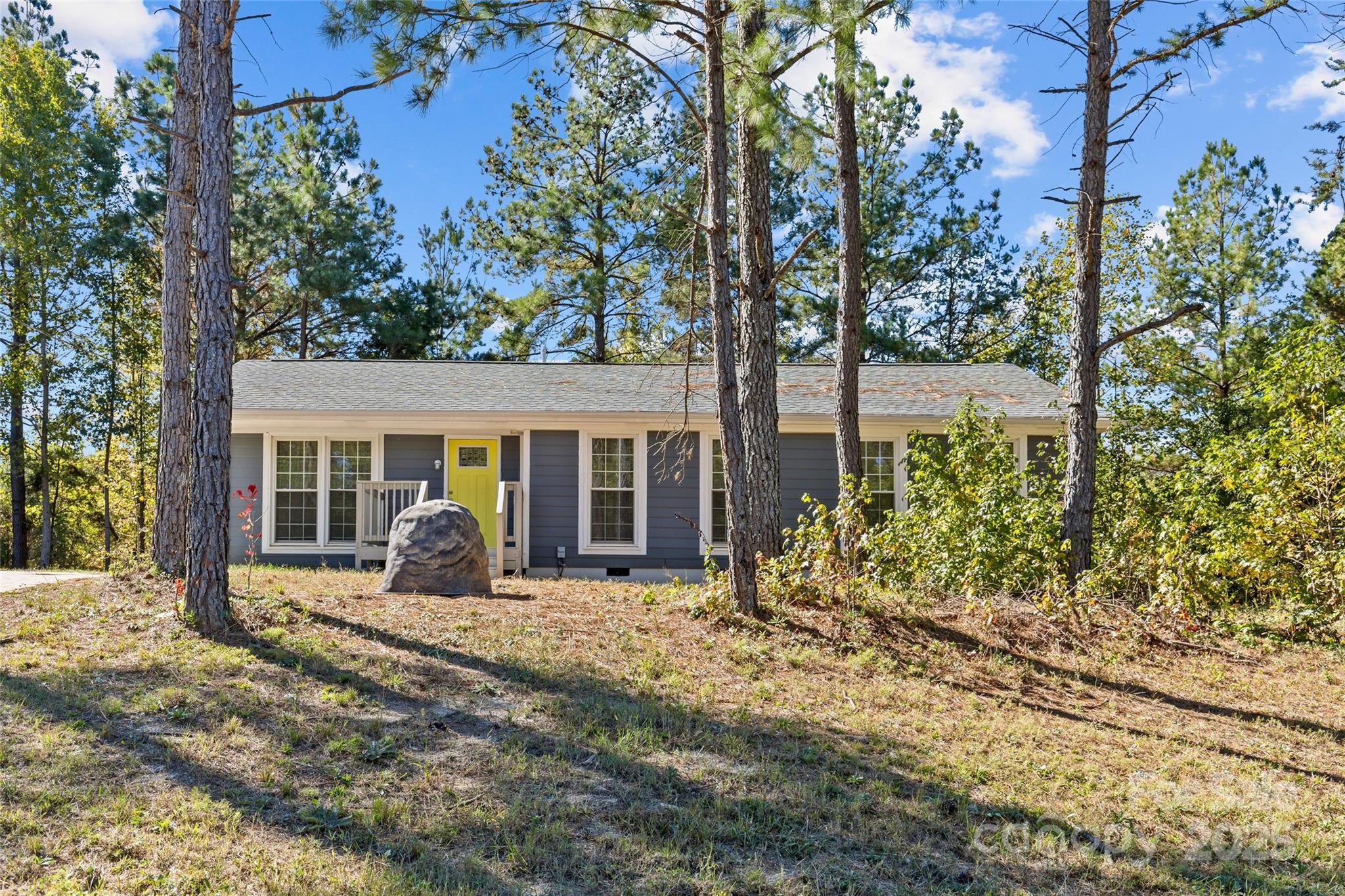 8341 Reedy Creek Road Charlotte, NC 28215 - Photo 3 of 40 a front view of house with yard and trees around