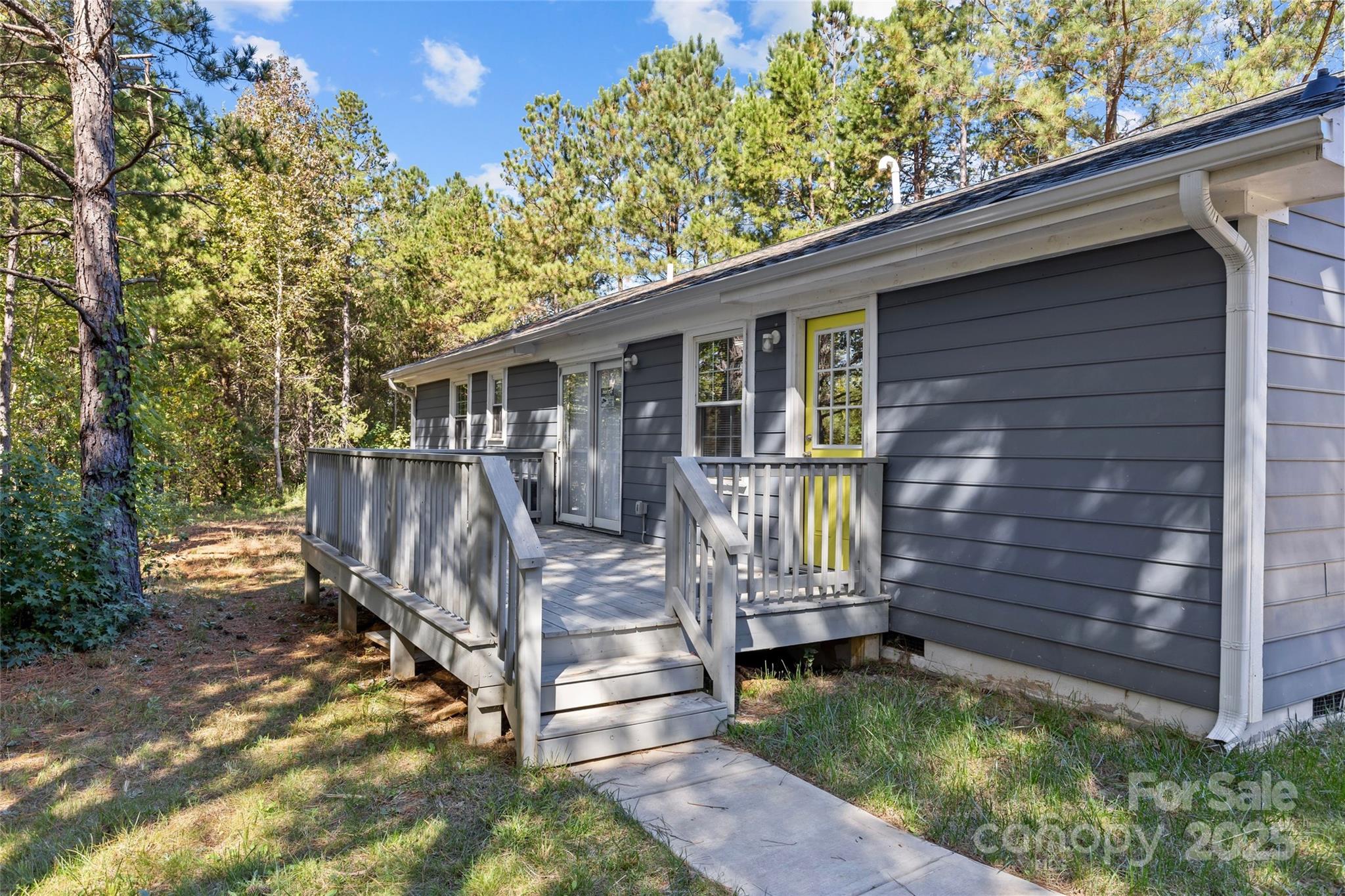 8341 Reedy Creek Road Charlotte, NC 28215 - Photo 37 of 40 a view of a house with a yard and wooden fence