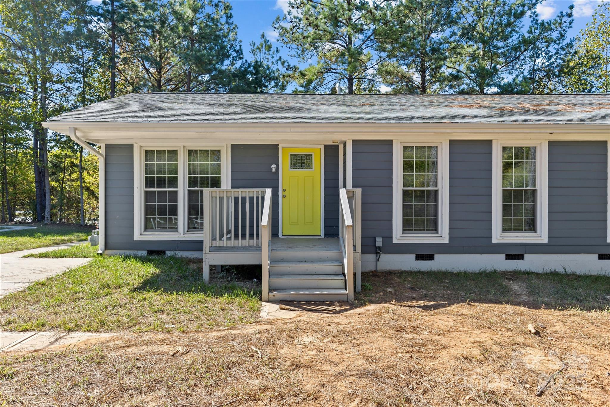 8341 Reedy Creek Road Charlotte, NC 28215 - Photo 4 of 40 front view of a house with a yard