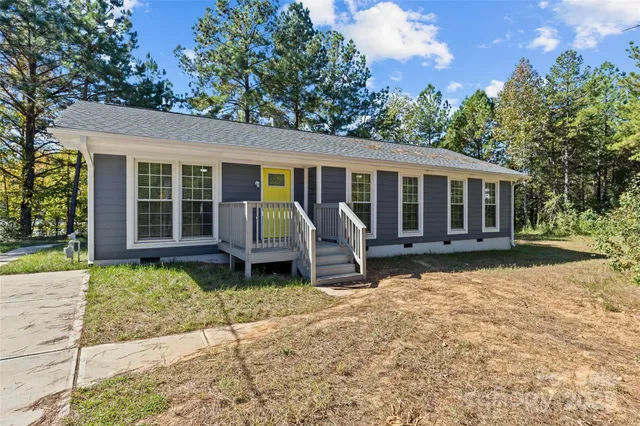 a house with yard in front of it