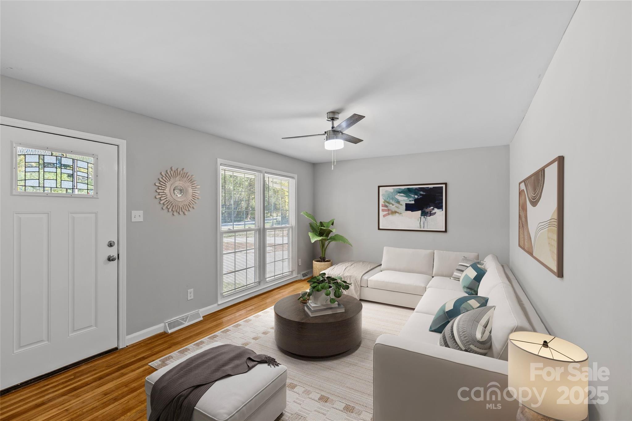 8341 Reedy Creek Road Charlotte, NC 28215 - Photo 8 of 40 a living room with furniture and a large window