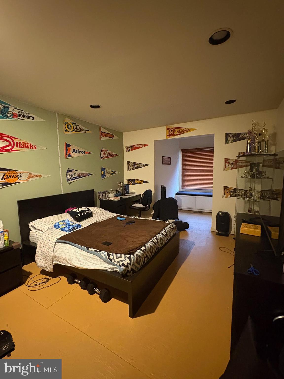 23 Raisin Tree Circle Baltimore, MD 21208 - Photo 3 of 10 a bed sitting in a bedroom next to a window