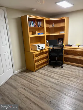 a view of bedroom with furniture and window