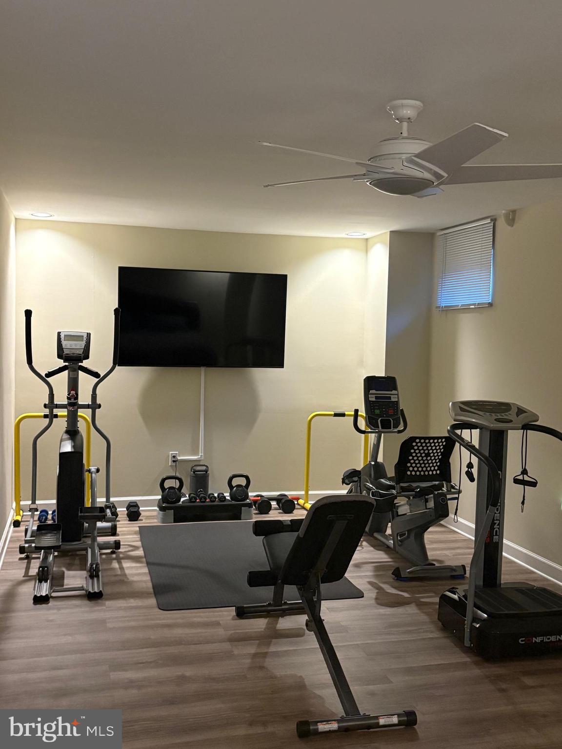 23 Raisin Tree Circle Baltimore, MD 21208 - Photo 9 of 10 a room with gym equipment and a flat screen tv