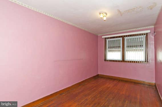 307 West Riverview Road Baltimore, MD 21225 - Photo 14 of 26 a view of empty room with wooden floor and fan