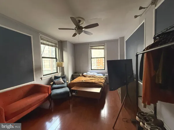 a bedroom with furniture and a window