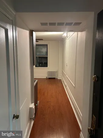 a view of gallery with wooden floor
