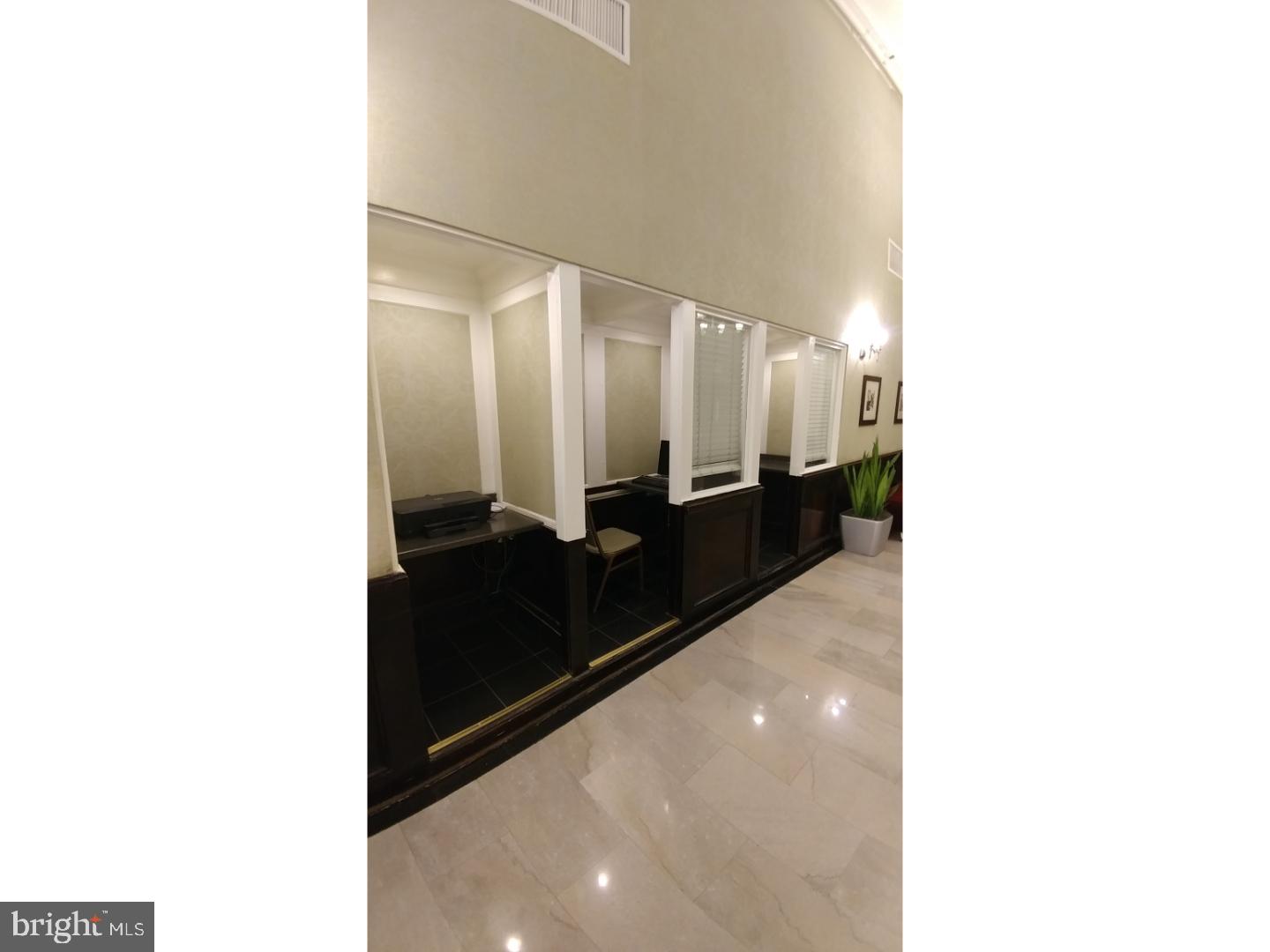 1324 Locust Street, Unit 512 Philadelphia, PA 19107 - Photo 5 of 14 a bathroom with a sink and a mirror