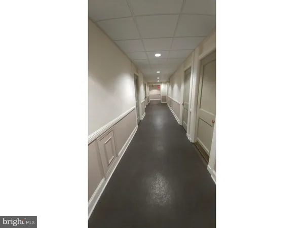 a view of a hallway with staircase