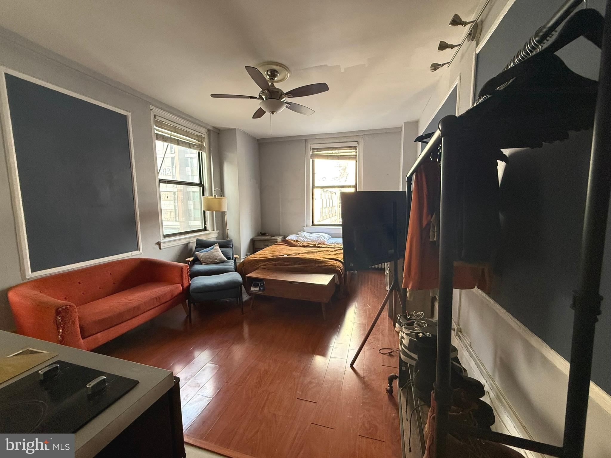 1324 Locust Street, Unit 512 Philadelphia, PA 19107 - Photo 10 of 14 a bedroom with furniture and wooden floor