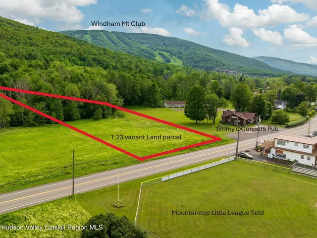 a view of a tennis ground with a large park