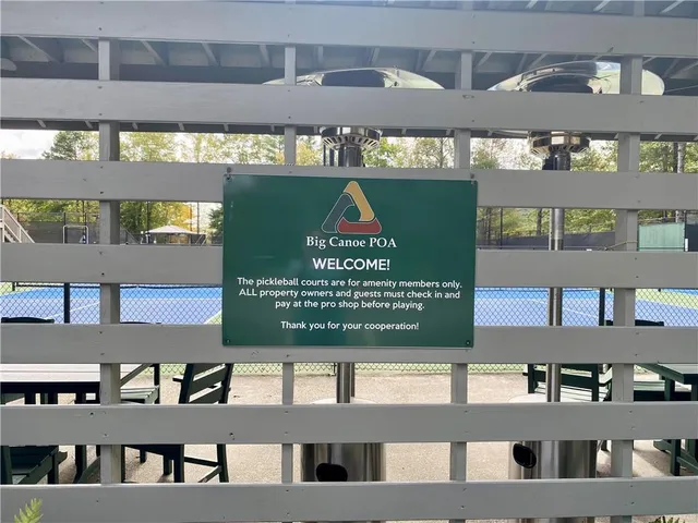 a view of outdoor space with deck and trees