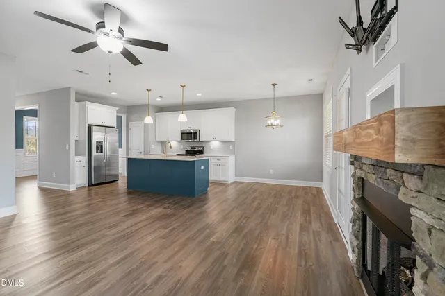 a view of kitchen with sink microwave and stove