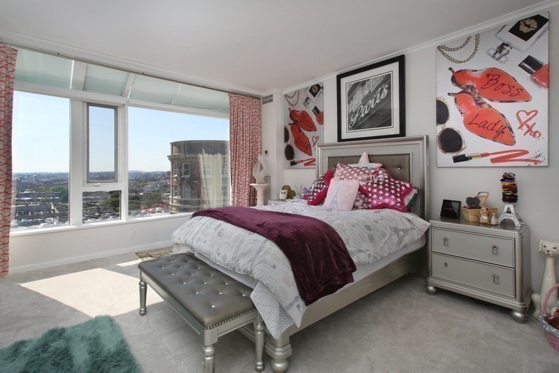 220 Boylston Street, Unit 1612/1624 Boston, MA 02116 - Photo 12 of 26 a spacious bedroom with a bed painting on the wall and a large window