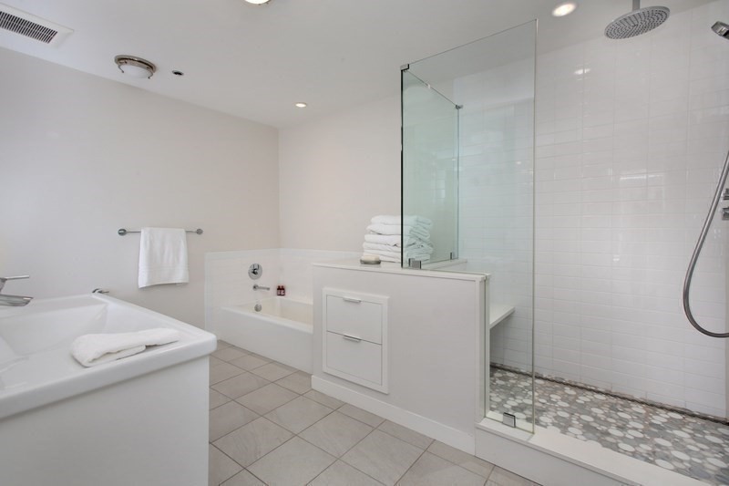 220 Boylston Street, Unit 1612/1624 Boston, MA 02116 - Photo 13 of 26 a bathroom with a sink a toilet and shower