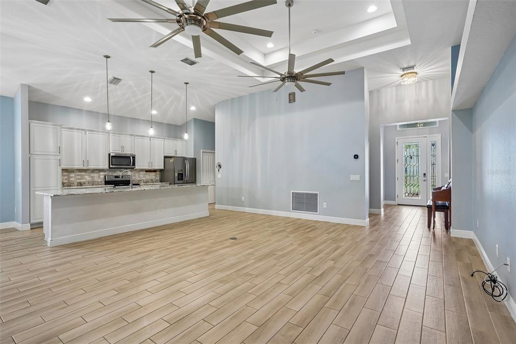 10339 Addison Shore Way Oxford, FL 34484 - Photo 29 of 54 a view of large kitchen with a sink dishwasher a refrigerator and wooden floor