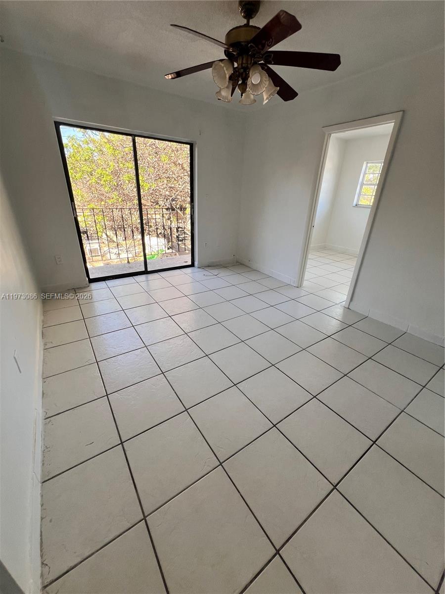 a view of an empty room and window