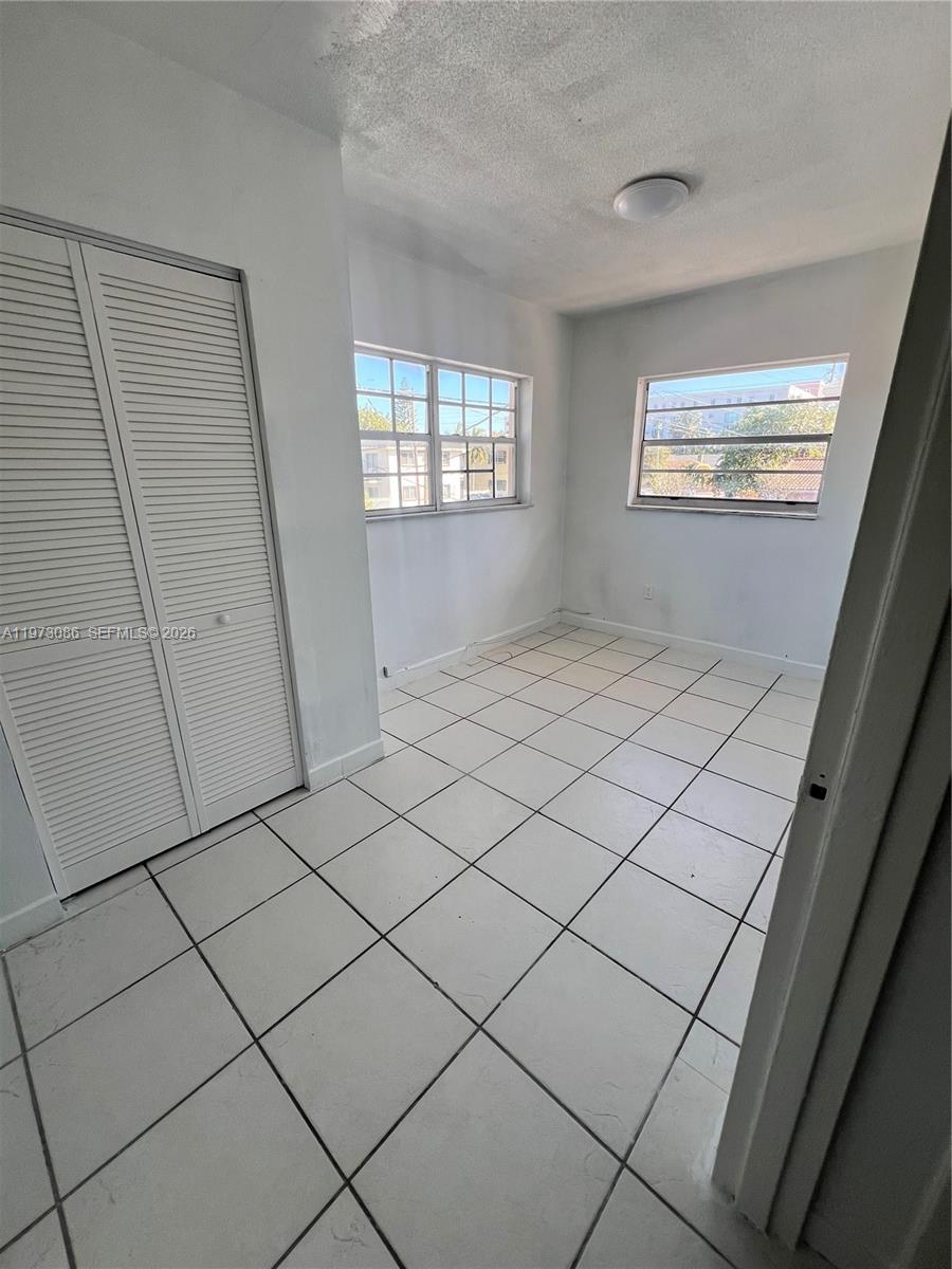 608 Southwest 15th Avenue, Unit 2 Miami, FL 33135 - Photo 11 of 22 a view of an empty room and window