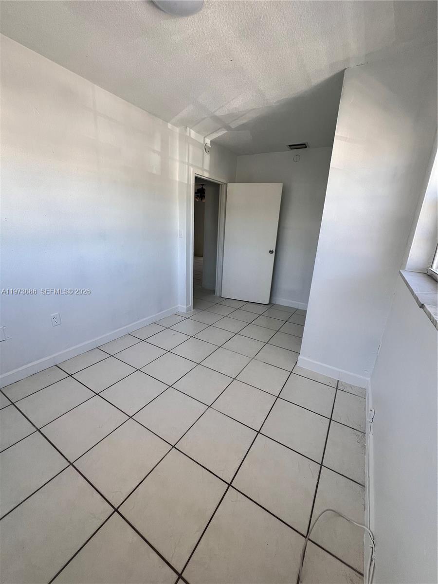 608 Southwest 15th Avenue, Unit 2 Miami, FL 33135 - Photo 13 of 22 a view of a garage