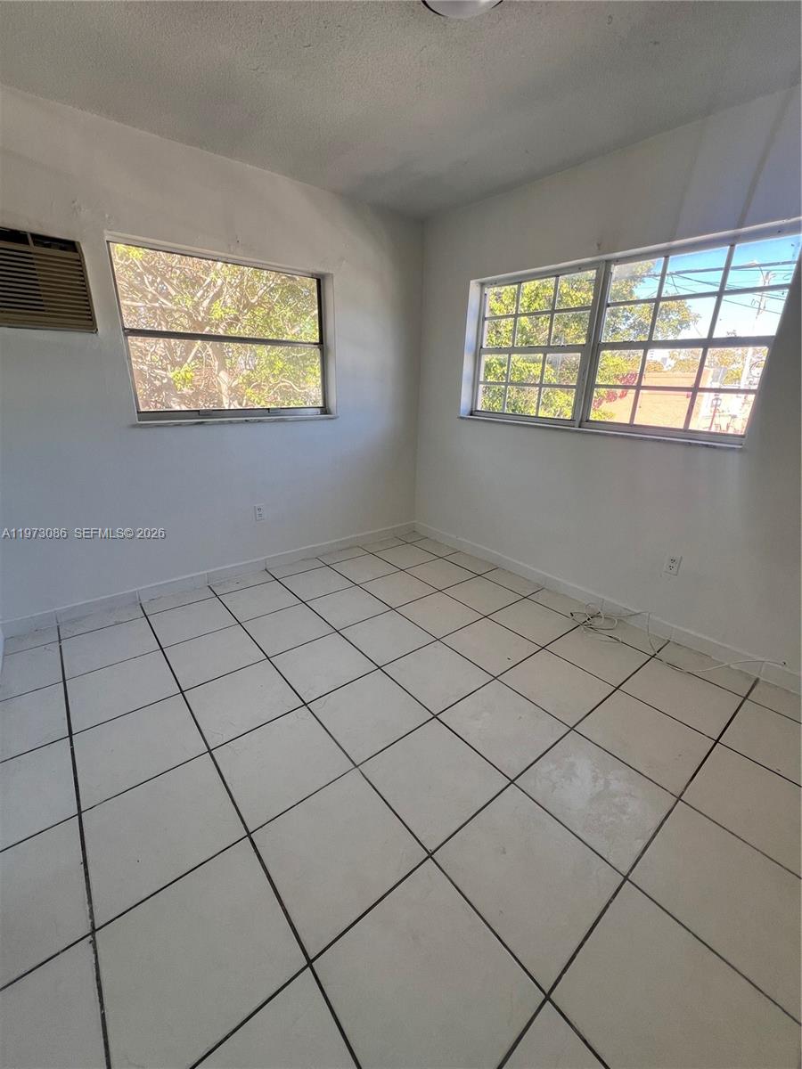 608 Southwest 15th Avenue, Unit 2 Miami, FL 33135 - Photo 16 of 22 a view of an empty room and a window