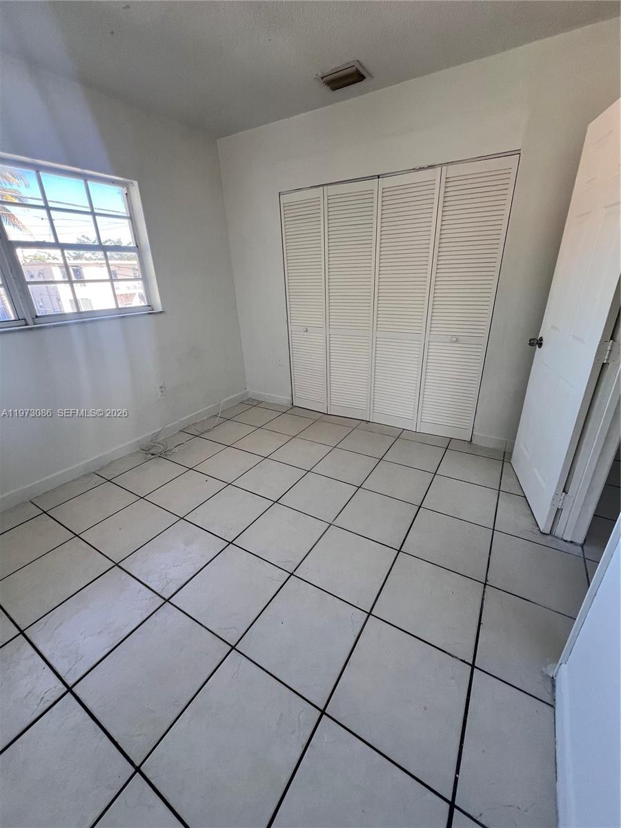 608 Southwest 15th Avenue, Unit 2 Miami, FL 33135 - Photo 17 of 22 a view of a garage and window