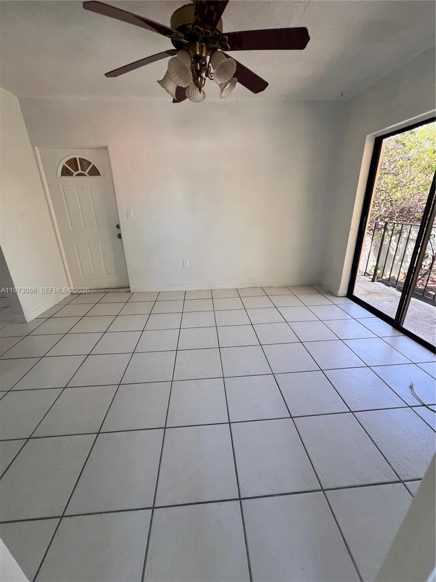 608 Southwest 15th Avenue, Unit 2 Miami, FL 33135 - Photo 3 of 22 a view of an empty room with a window