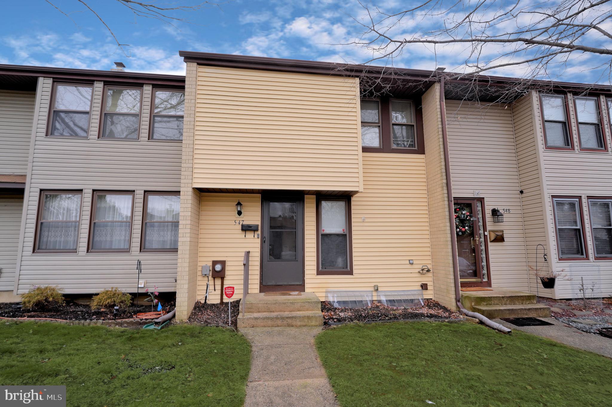 547 Fairfield Road East Windsor, NJ 08520 - Photo 1 of 28 a front view of a house with a garden and plants