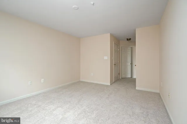 a bathroom with a double vanity sink mirror and shower