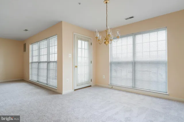 a kitchen with stainless steel appliances granite countertop a stove microwave and refrigerator