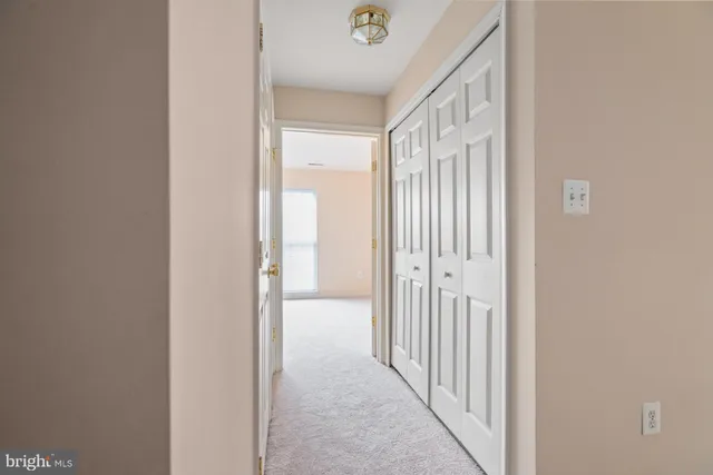 a view of a hallway with a door