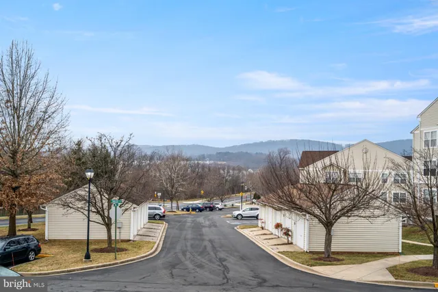 a view of a balcony with furniture and a fireplace