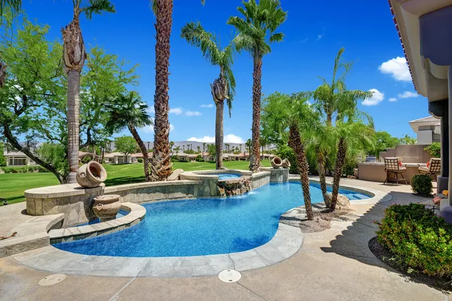 a view of a park with fire pit