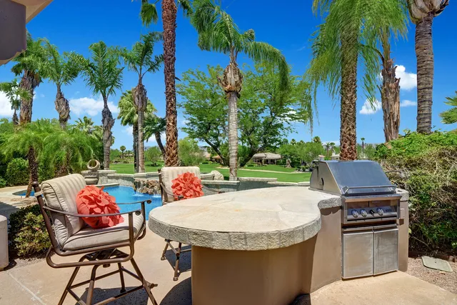 a view of a backyard with sitting area