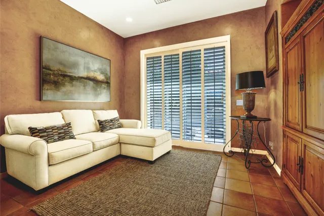 a living room with furniture and a window