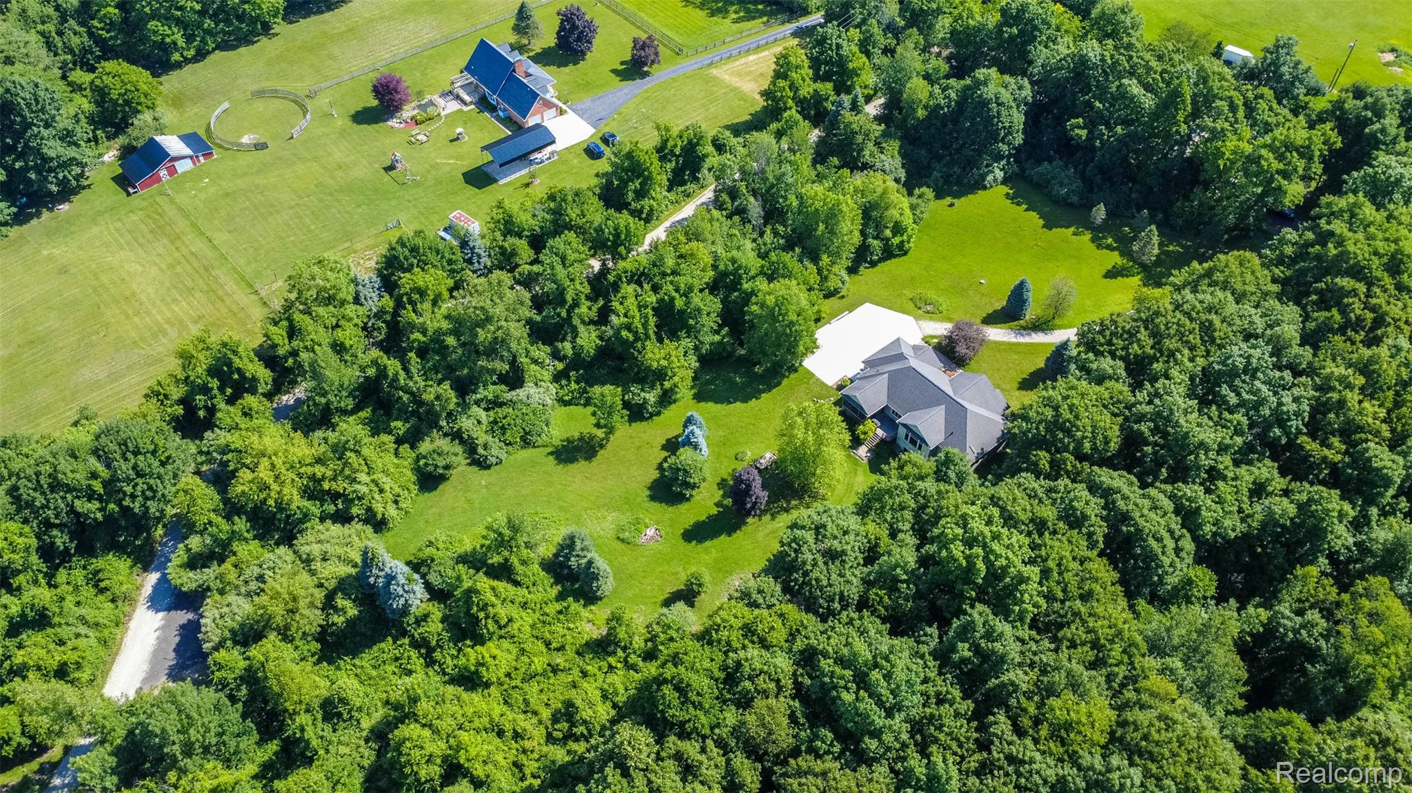 9887 Hadley Road Clarkston, MI 48348 - Photo 49 of 56 Expansive aerial perspective showcasing a spacious property enveloped by mature trees