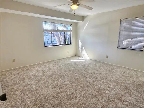a view of an empty room with a bathroom