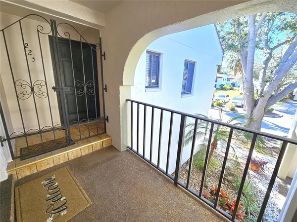 a view of a porch with furniture