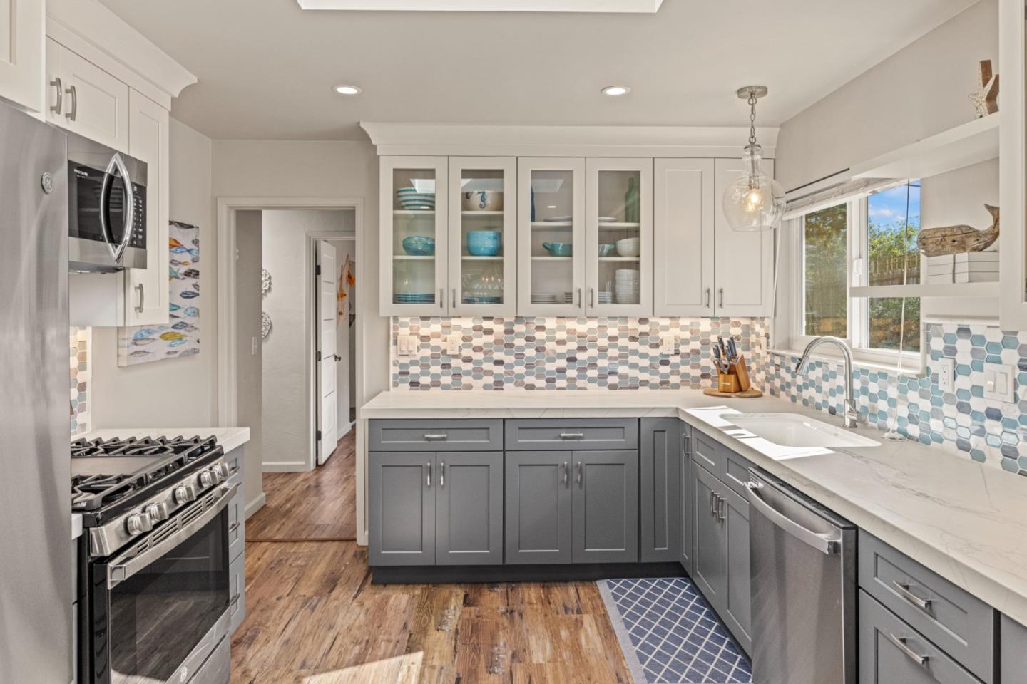 840 Filmore Street Monterey, CA 93940 - Photo 11 of 39 a kitchen with a sink stove and refrigerator