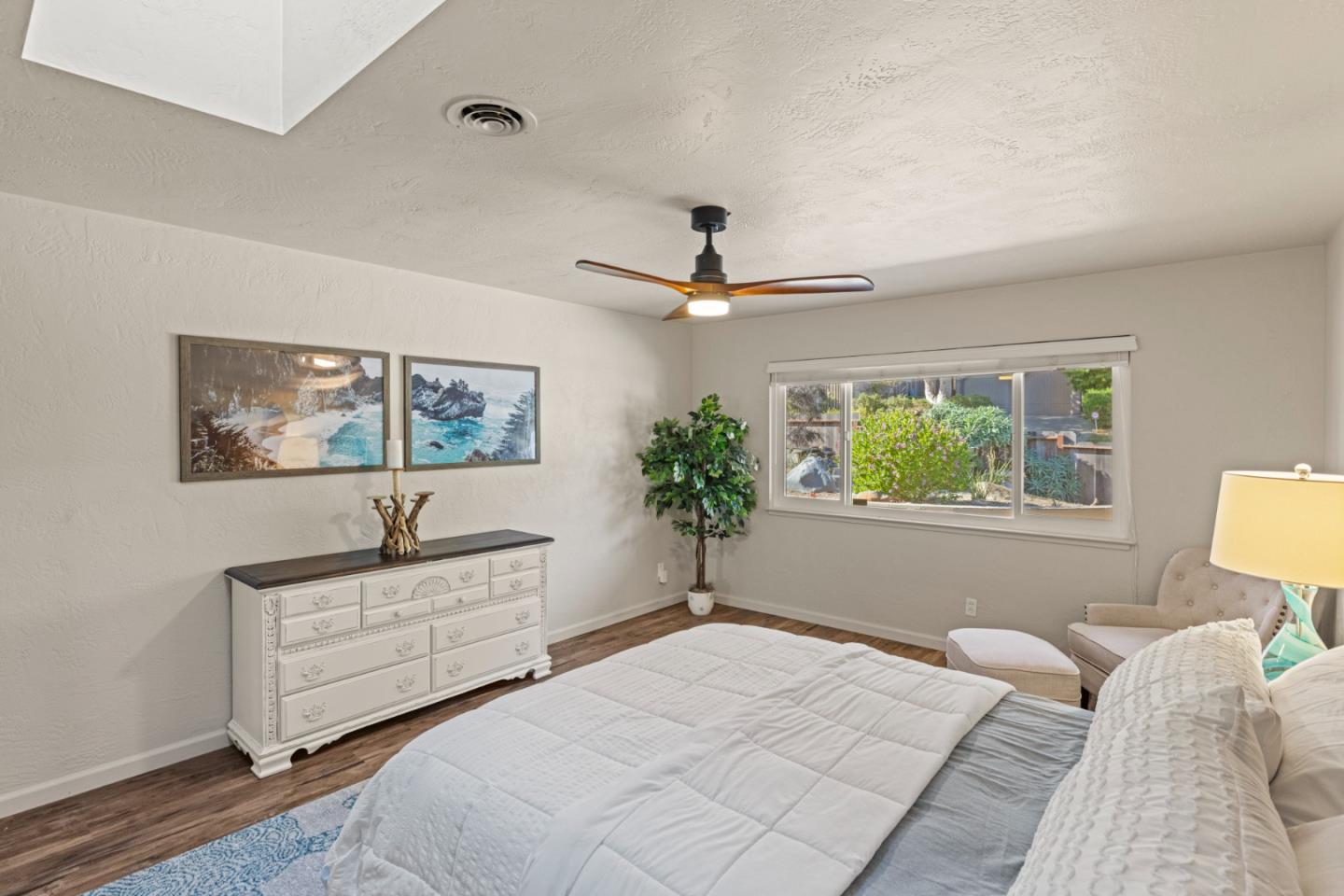 840 Filmore Street Monterey, CA 93940 - Photo 15 of 39 a bedroom with a bed and a chandelier