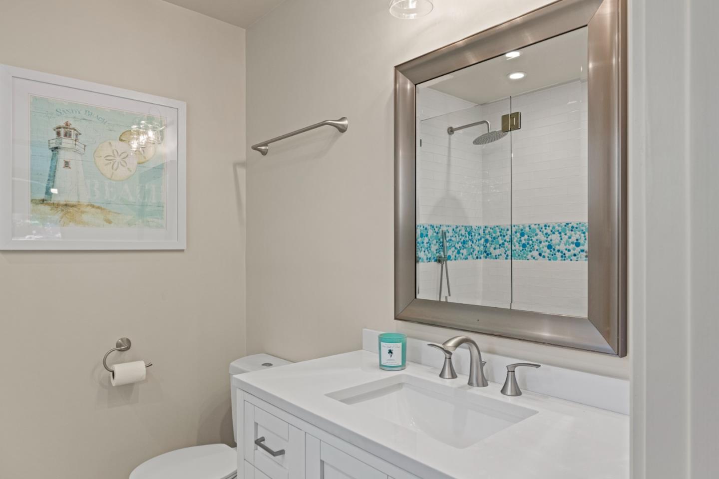 840 Filmore Street Monterey, CA 93940 - Photo 16 of 39 a bathroom with a sink and mirror with toilet