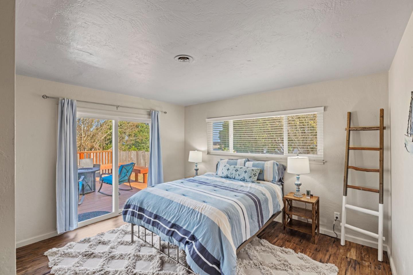 840 Filmore Street Monterey, CA 93940 - Photo 18 of 39 a bedroom with a large bed and a window