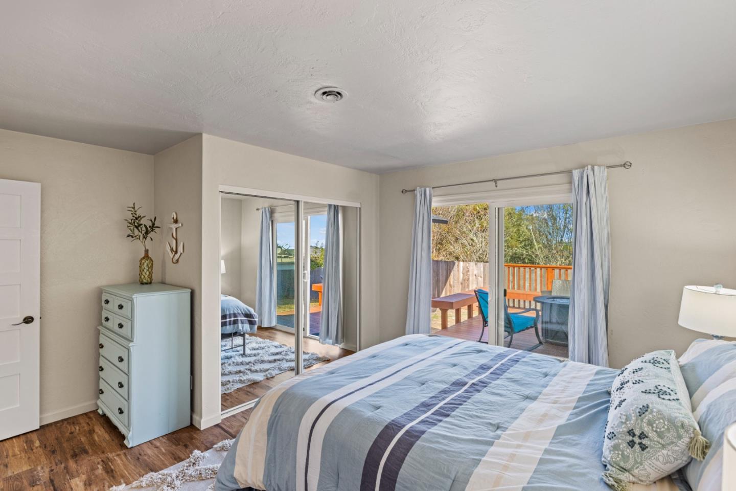 840 Filmore Street Monterey, CA 93940 - Photo 20 of 39 a bedroom with a large bed and a large window