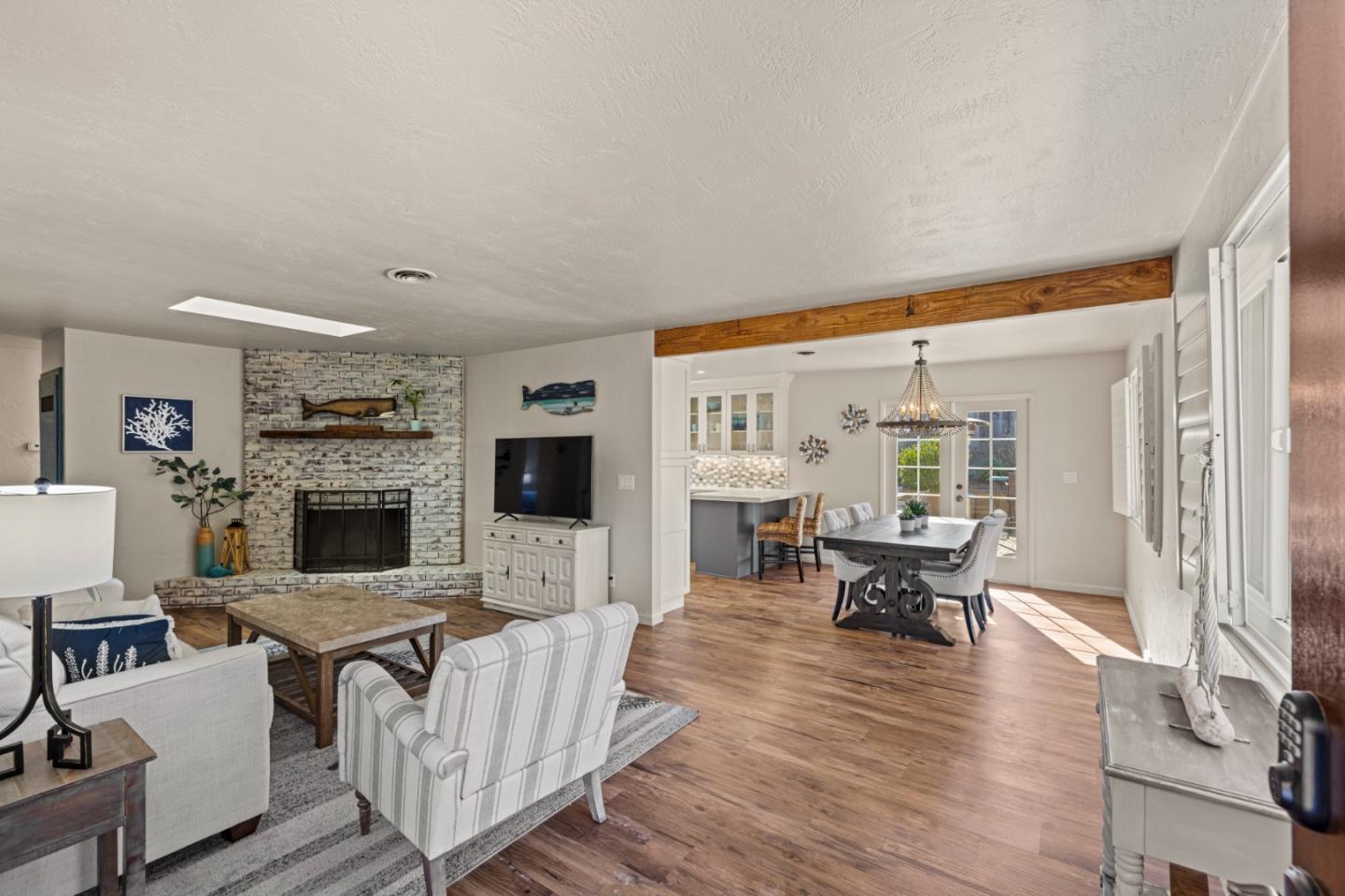 840 Filmore Street Monterey, CA 93940 - Photo 2 of 39 a living room with furniture a fireplace and a flat screen tv