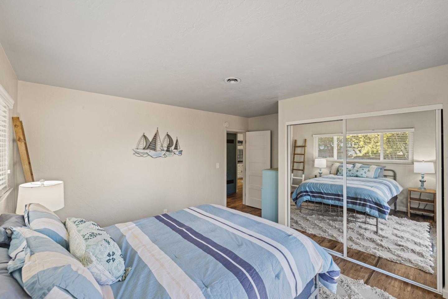 840 Filmore Street Monterey, CA 93940 - Photo 21 of 39 a bedroom with a bed and a large window